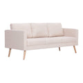 Canapé moderne en tissu beige avec pieds en bois clairs.