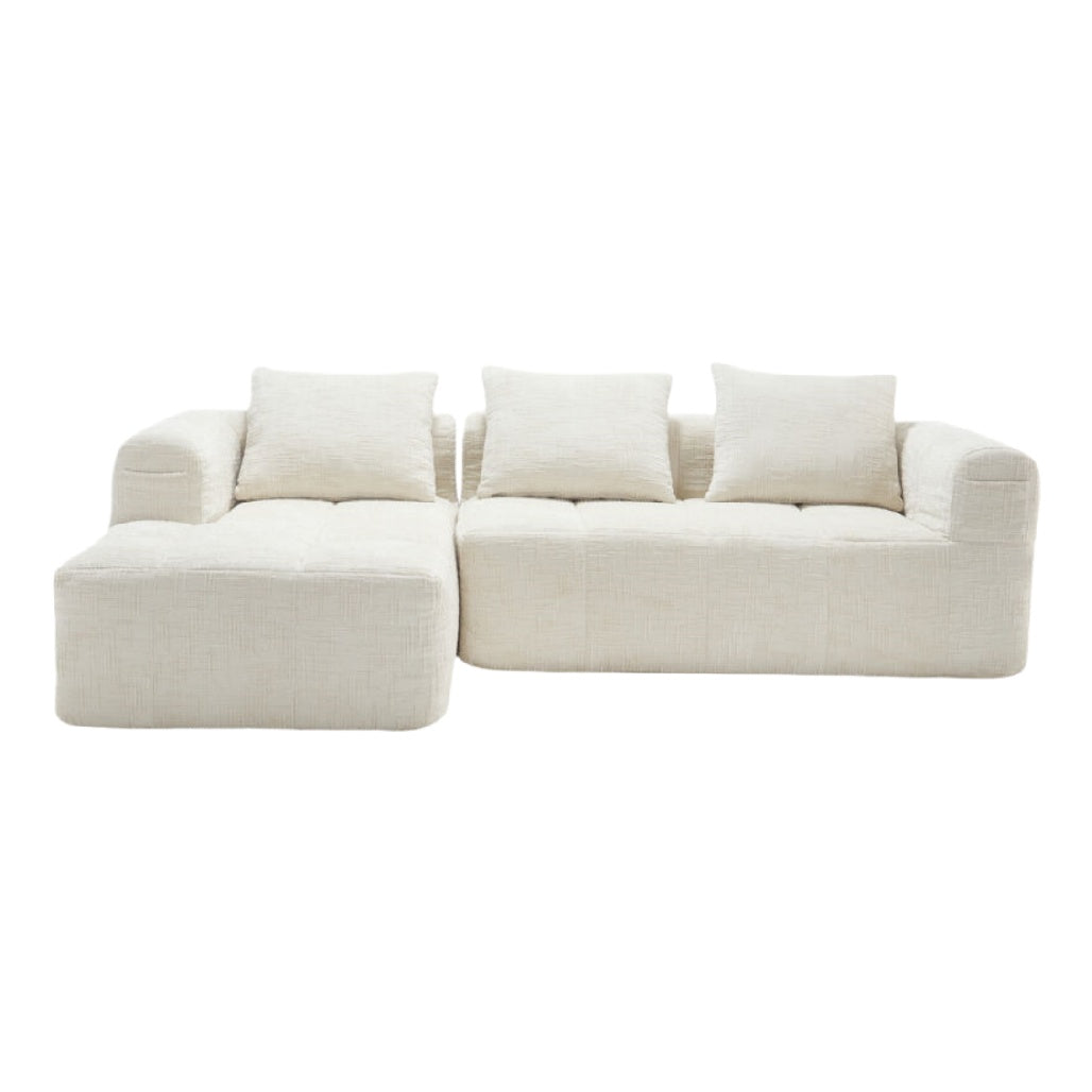 Canapé modulable couleur crème avec espaces de rangement intégrés.